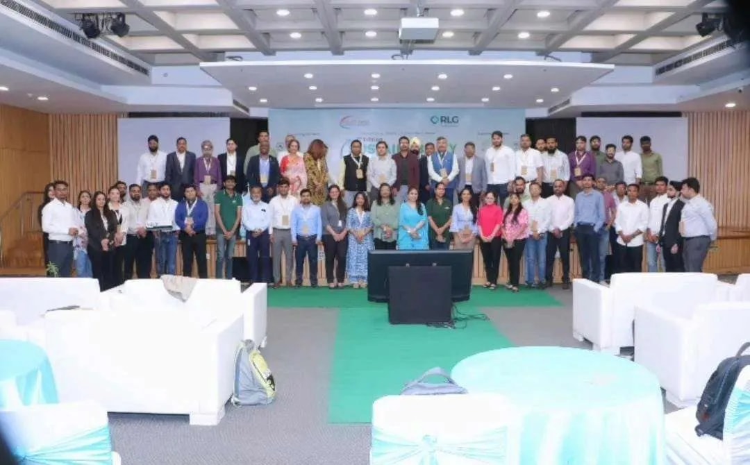 Large group photo of participants in a conference hall